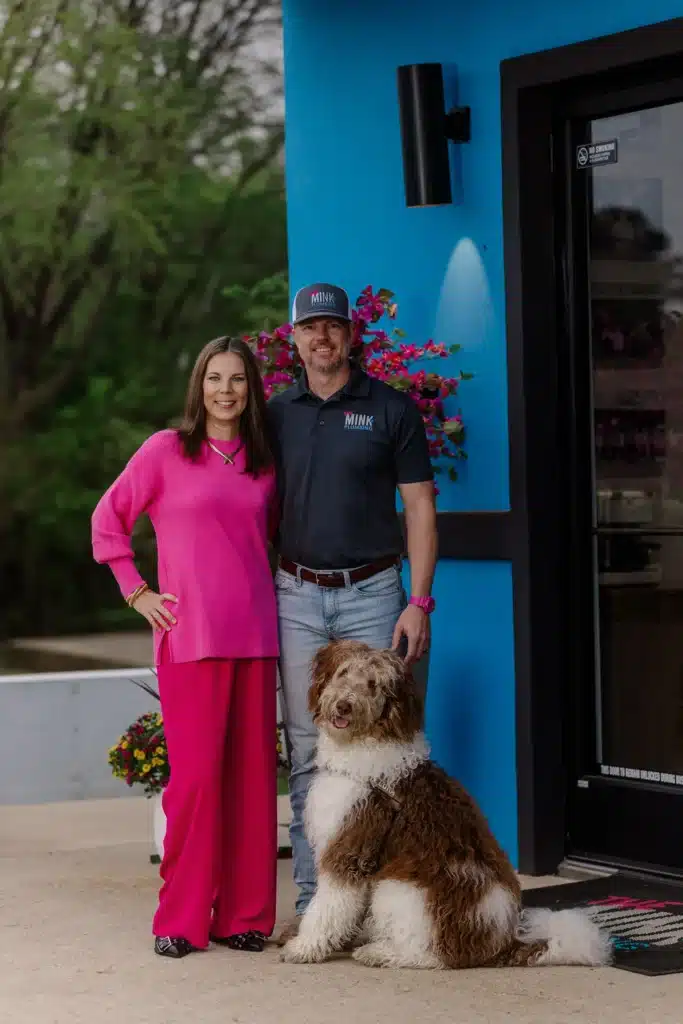 Amber and Glenn of THE Mink Plumbing with their dog