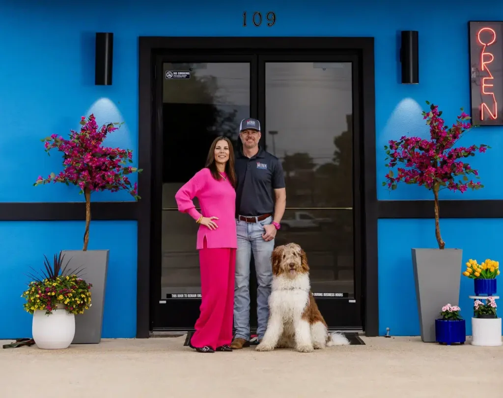 Amber and Glenn of THE Mink Plumbing with their dog